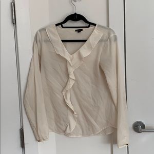 Ann Taylor cream blouse with ruffle detail